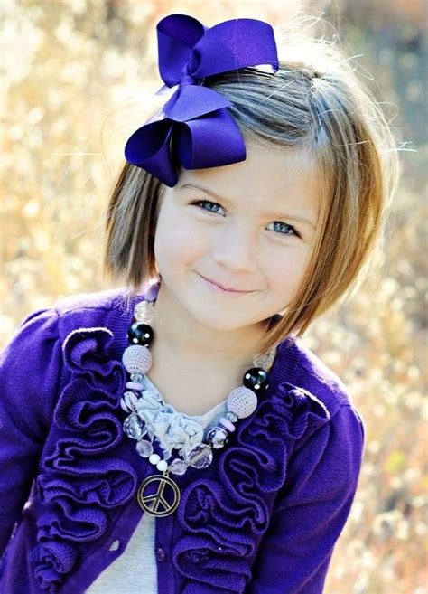 The hair is cut just above the chin and a beautiful sense of style and fashion is created by combining it with a nice hair accessory and leaving the bangs falling over on the forehead. . 5 year old haircuts girl